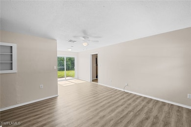 Livingroom / dining area featuring wood finished f