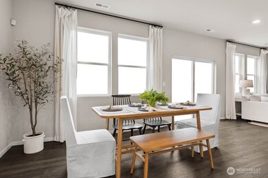Dining space can accommodate a large table to host dinner parties. Actual home is under construction. Colors, materials, and features may vary. See site agent for details.