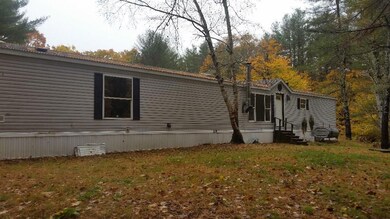 Back side, yard leads down to...