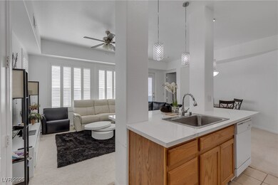 Kitchen featuring light carpet, open floor plan, c
