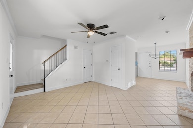 Unfurnished living room with ornamental molding, 