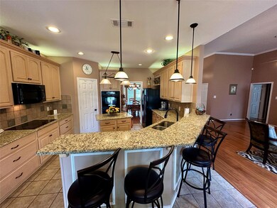 Kitchen featuring visible vents, light brown cabin