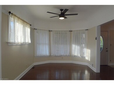 Gorgeous hardwood floor throughout living room, dining room, and foyer