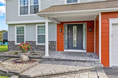 Beautiful hardscape entry with stylish, modern door.