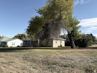 View of front of property featuring brick siding and a front lawn