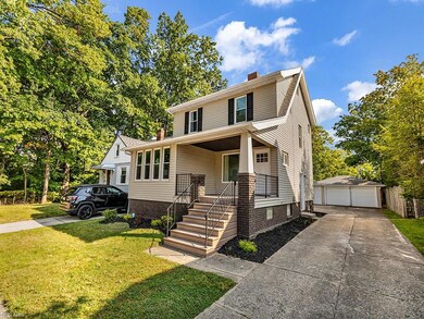 Front of property with garage and a front lawn