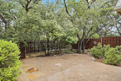 View of yard featuring fence and a patio area