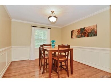 Elegant formal dining room featuring hardwood floo