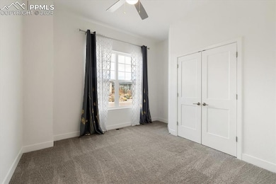 Unfurnished bedroom with a closet, carpet flooring