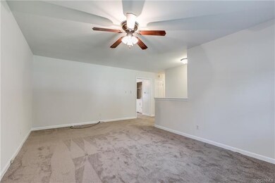 Spacious family room with ceiling fan