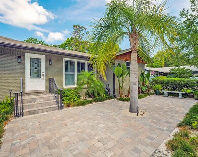 Inviting Front Door with a courtyard