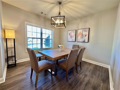 Dining room featuring visible vents, dark wood-sty