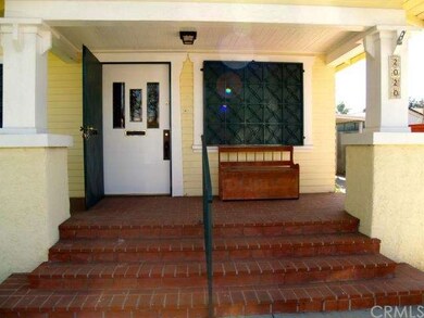 Original front door, brick porch