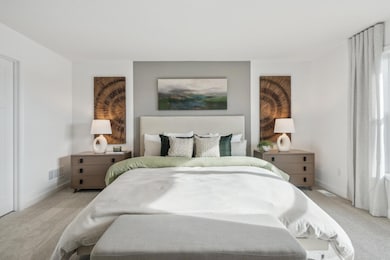 (Photo of decorated model, actual homes finishes will vary) Find your retreat in the stunning primary bedroom!