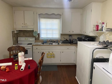 kitchen/ dining/ laundry area