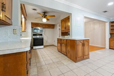 Kitchen featuring gas range gas stove, light hardw