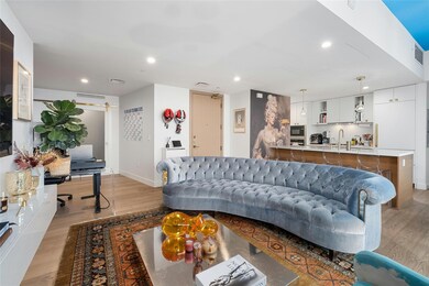 Living area featuring light wood-style floors, re