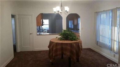 Spacious Dining Room with new carpet and chandelie