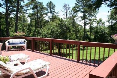 Recently refurbished rear deck area overlooks a sc