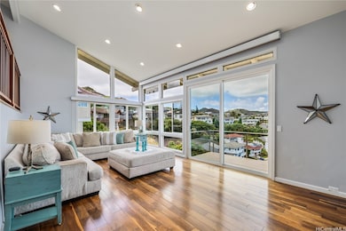 The Living Room boasts high ceilings, recessed lig