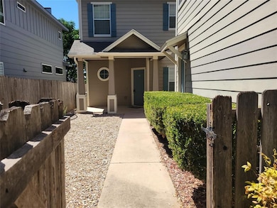 Property entrance featuring fence