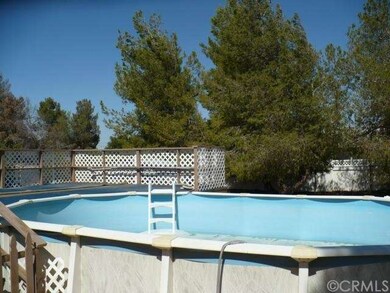 Above ground pool with large decking.