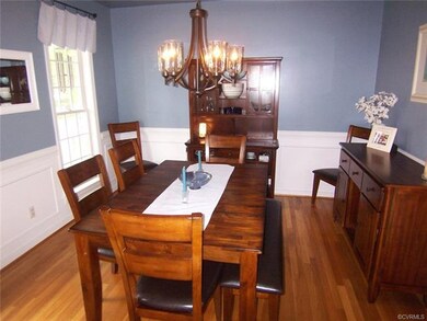 Dining room with hardwood floors, tray ceiling, cr