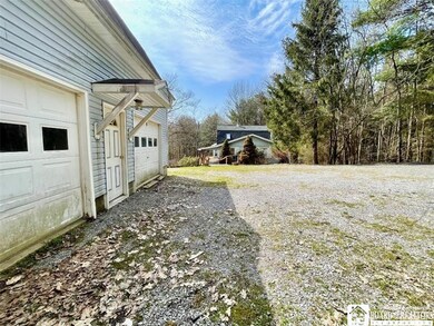 2 story 2 car garage looking at the cabin
