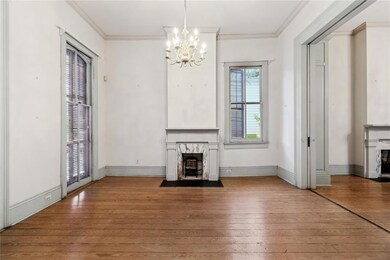 Living rm w/marble mantel , pocket doors & floor t