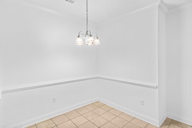 Unfurnished dining area featuring a chandelier, li