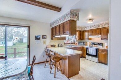 Dining area off kitchen with slider