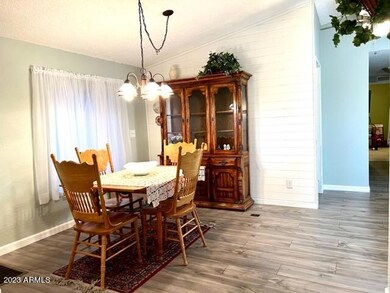 DINING AREA TO HALLWAY BEDROOMS AND BATH