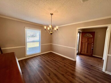 The separate dining rm is located to the right as 