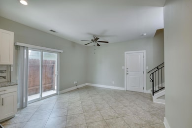 Empty room with light tile patterned floors, visi