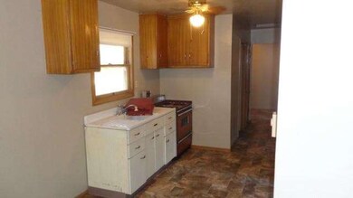 Kitchen with nice new flooring.