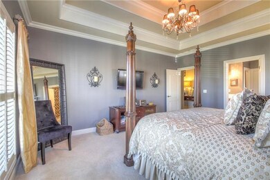 The master bedroom has a triple tray ceiling, cust