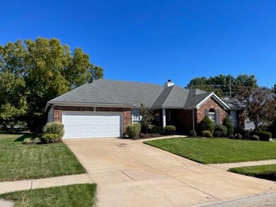 Great curb appeal with hip roof & brick front.