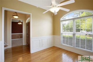 Separate, formal dining room has judges paneling, 