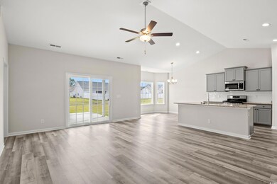 Kitchen with light wood-type flooring, appliances 