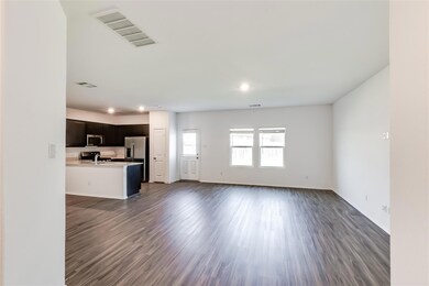 Unfurnished living room featuring dark wood-style