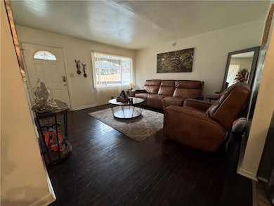 Living area with hardwood / wood-style floors and 