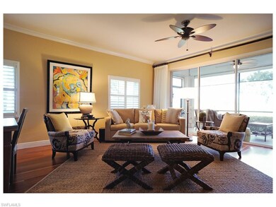 Living area w/crown molding, wood floors