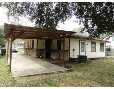 Exterior Front. Carport and Covered Porch