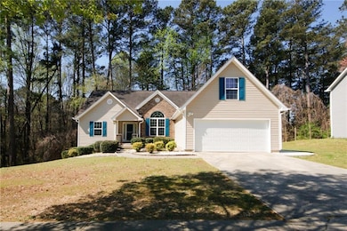 View of front of property featuring a garage and a