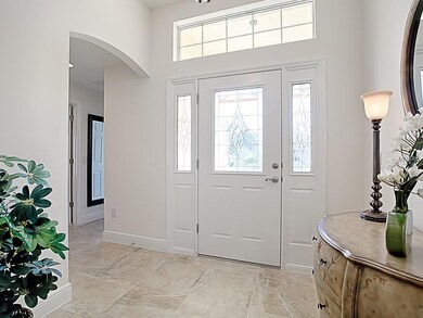 TRANSOM WINDOW OVER THE LEADED-GLASS FRONT DOOR FO
