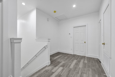 Crisp and clean upper-level hallway featuring neut