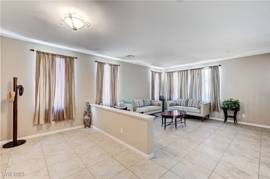 Living area featuring light tile patterned floors