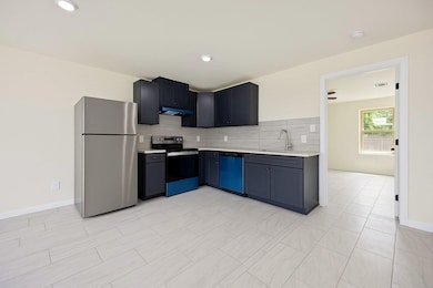 Modern and chic! Dark cabinets, granite countertops and stainless steel appliances This kitchen is a dream.- UNIT A