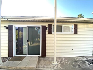 Entrance to property with a patio