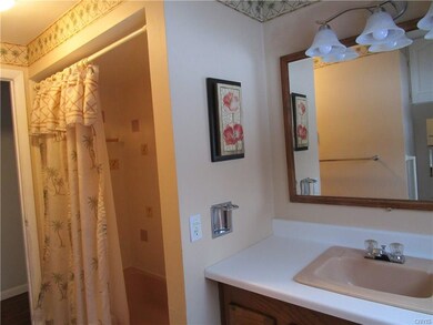 Tastefully decorated full bath on second level.